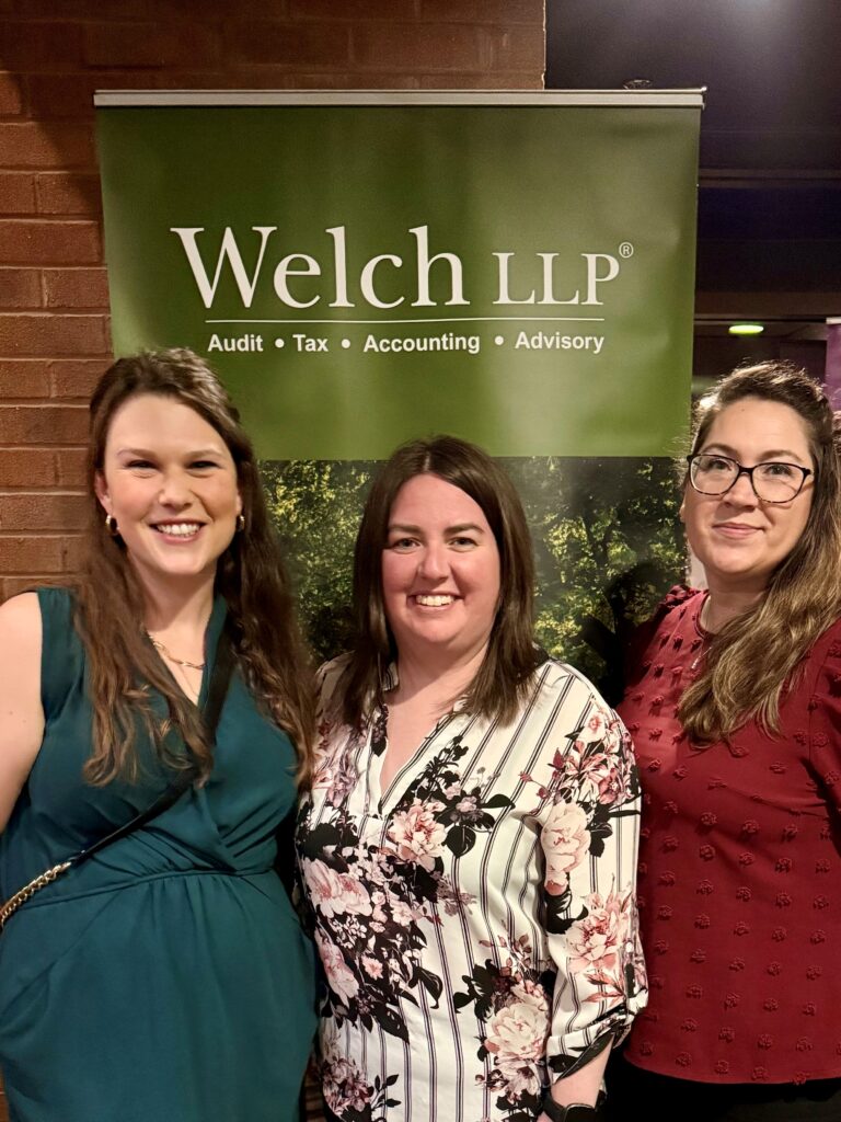 A group of Welch Staff posing for a photo at the Velvet Affair Gala